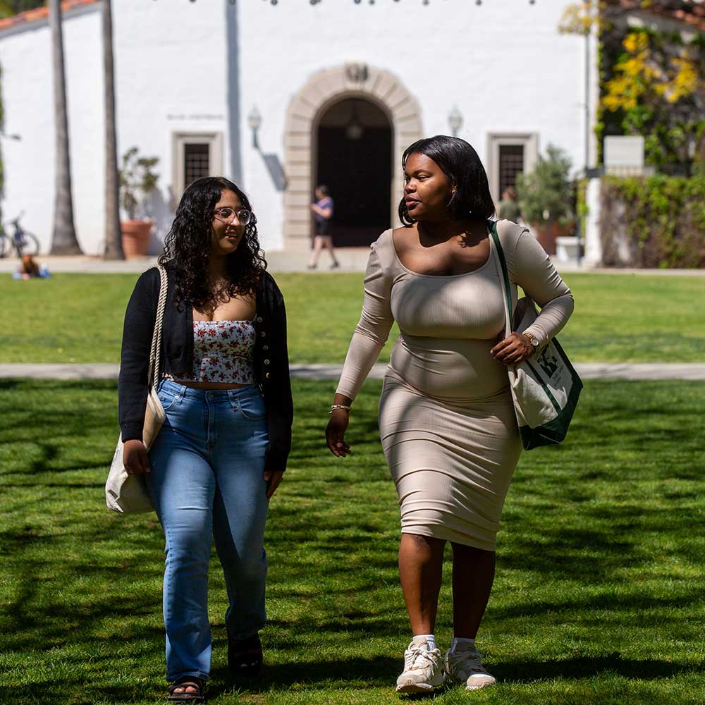 Two students walking on Elm Treen Lawn