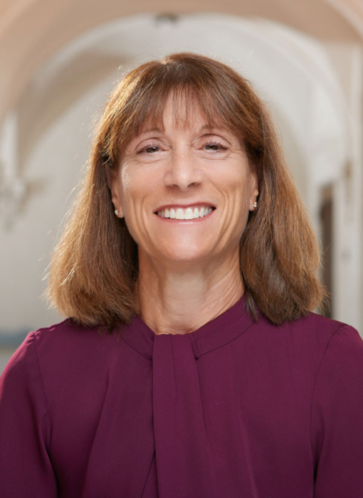 Portrait of president Amy Marcus-Newhall, plum colored dress