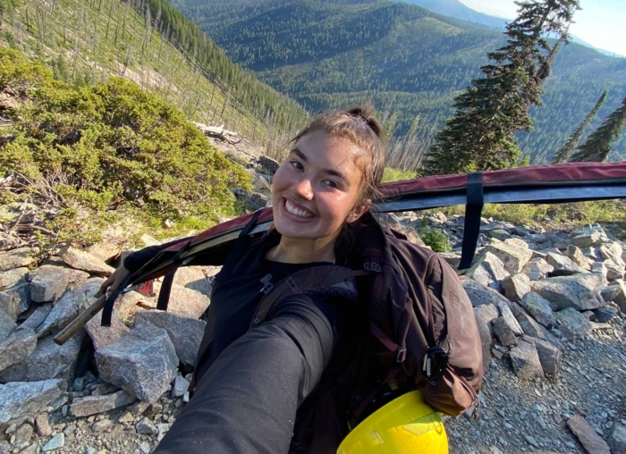 Student at an internship outside with equipment