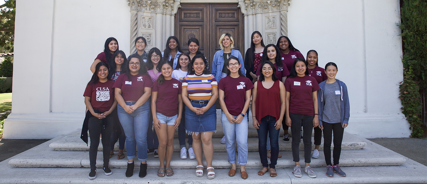 group of scripps college academy students standing in front of denison library doors