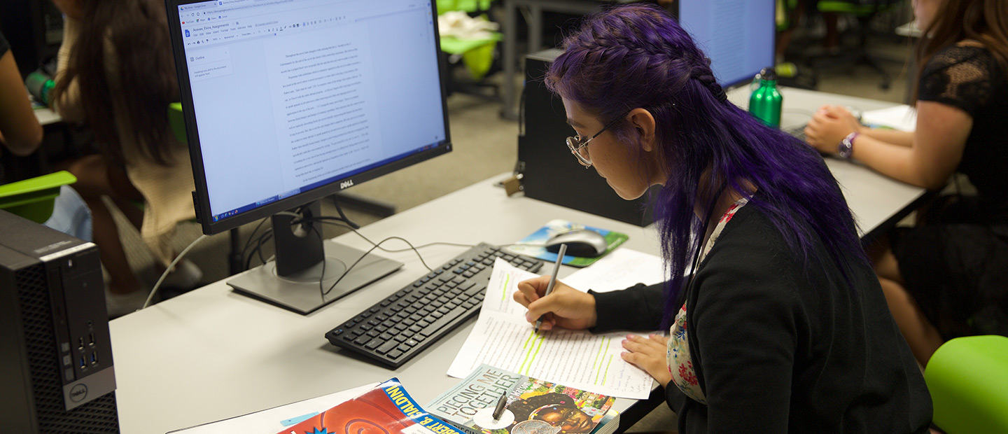 scripps college academy student studying at a computer