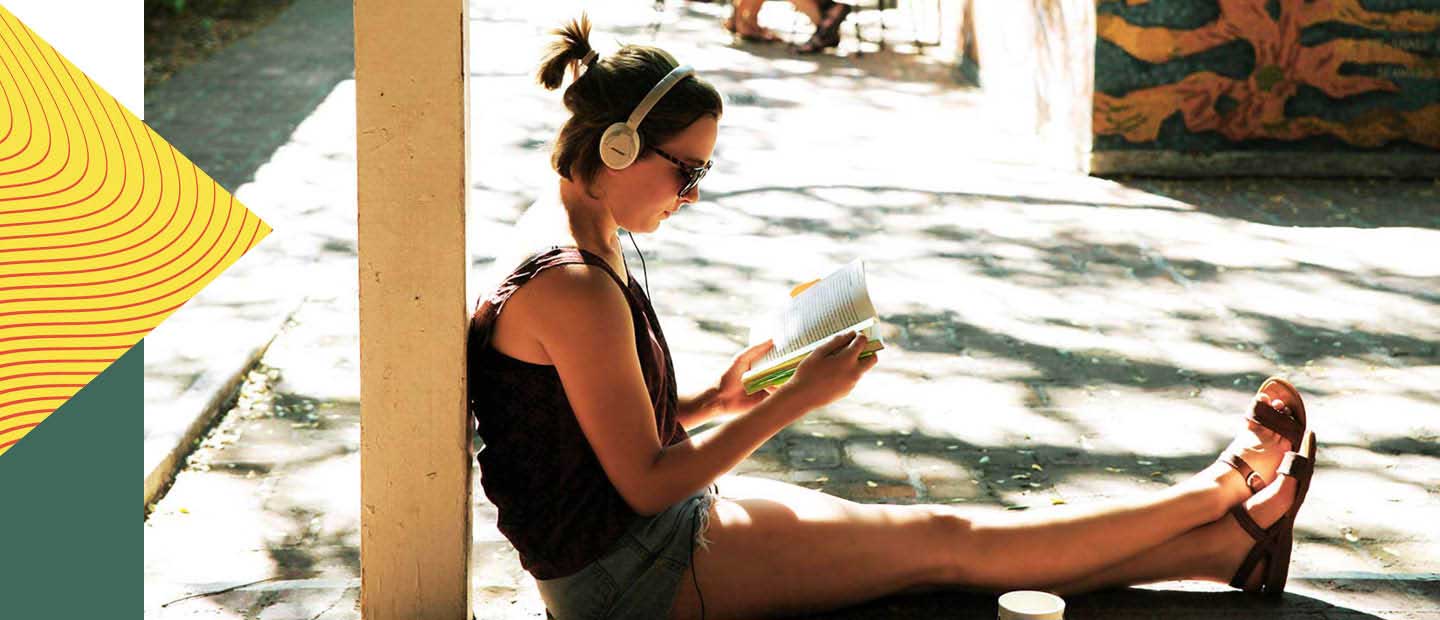 Student studying in Seal Court with headphones on