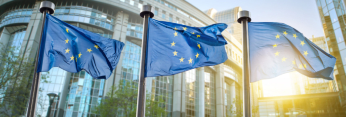 European union flag against parliament in Brussels, Belgium