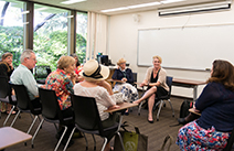 A group of people sitting in a classroom