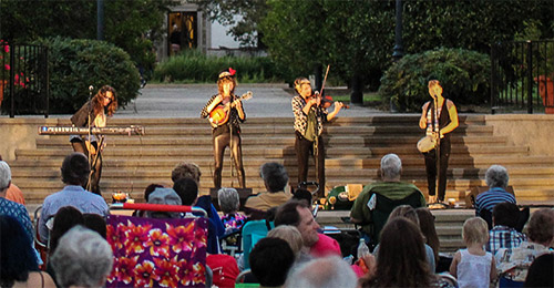 A band playing on the Wood Steps in front of Bowling Green Lawn at Scripps College