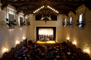 An orchestra playing onstage at Balch Auditorium