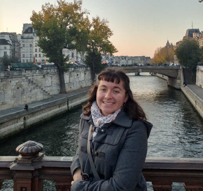 Hannah Orrahood '20 standing on a bridge in France