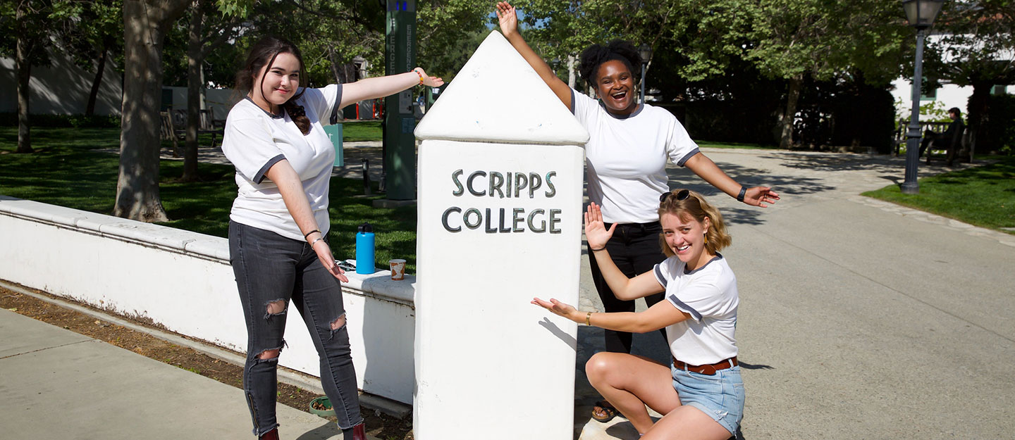 Students near Scripps sign outdoors