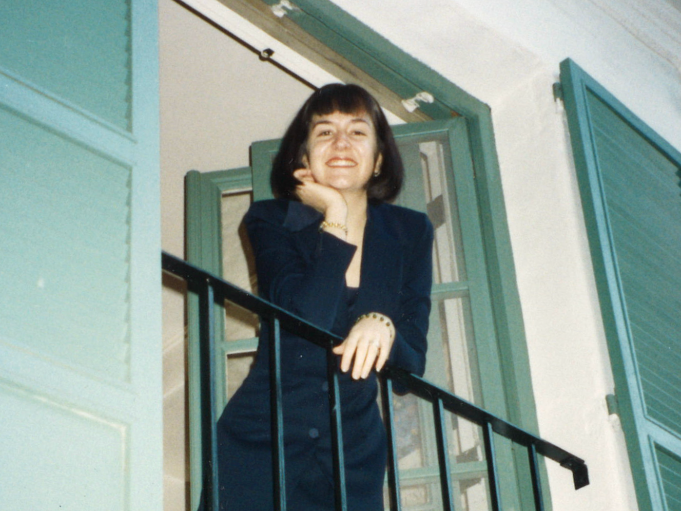 Jolene Hubbs '99, scholarship creator, standing on a balcony at Scripps in the early 1990s.