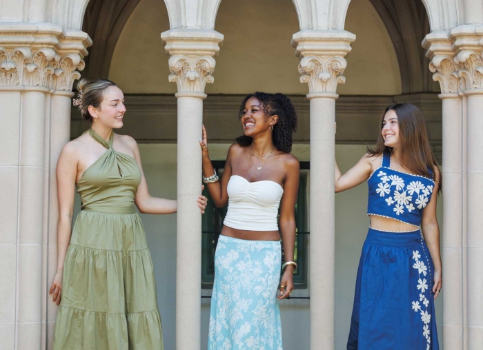 Women standing under pillars