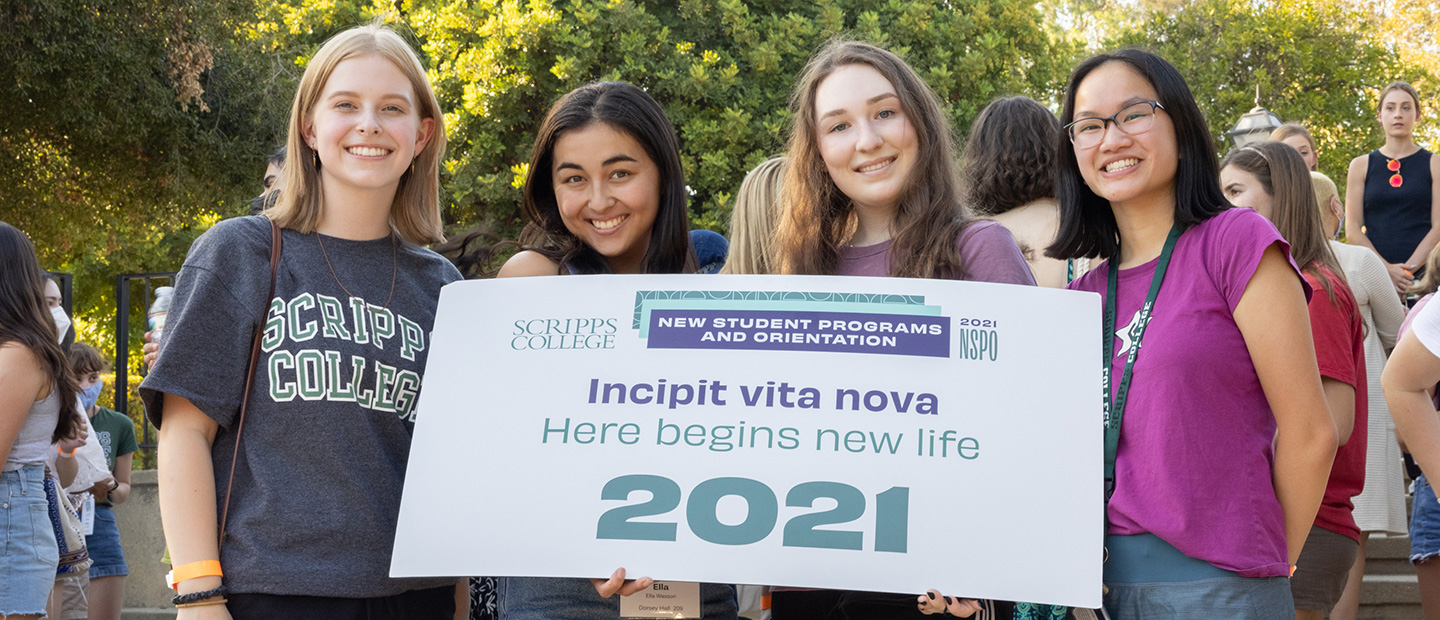 four students holding nspo sign