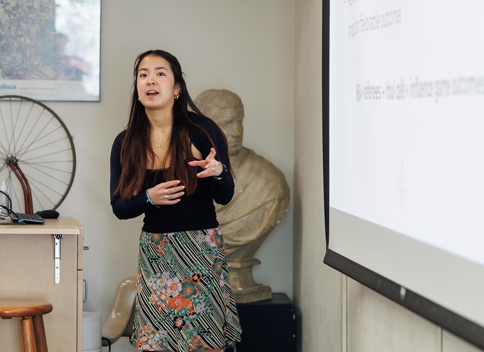 A senior giving a Capstone Day thesis presentation.