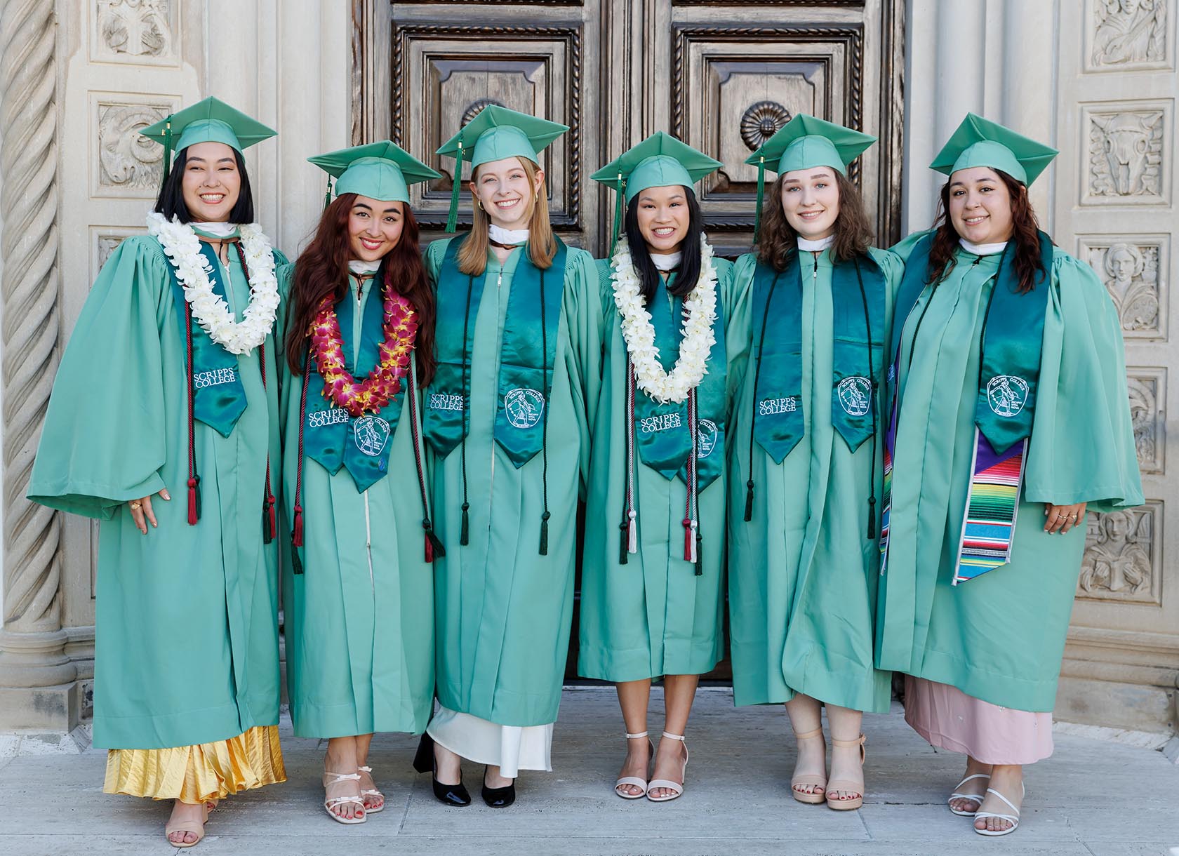 Students from the Class of 2024 stand together at Commencement.