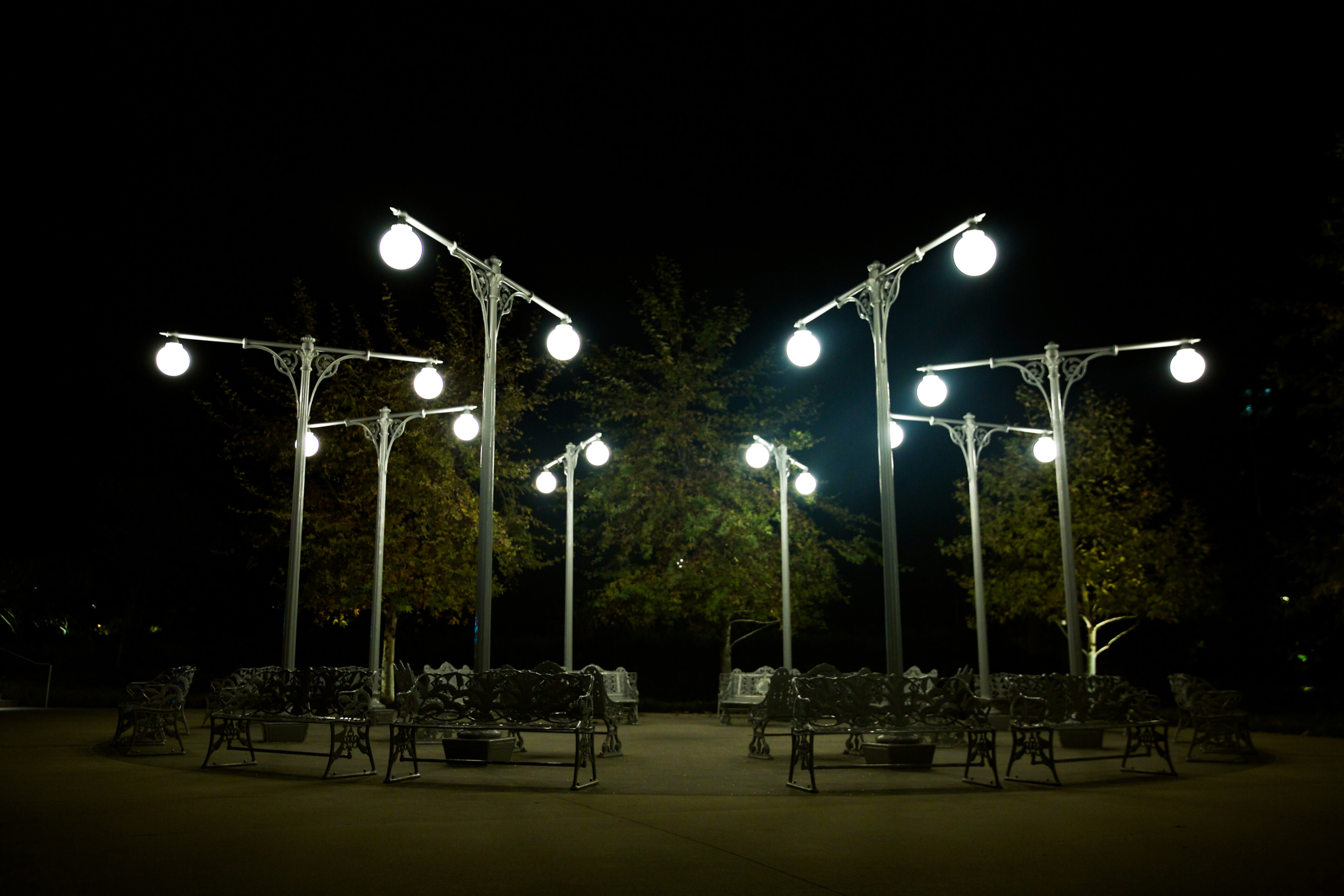 Street lamps and benches arranged in a circle.