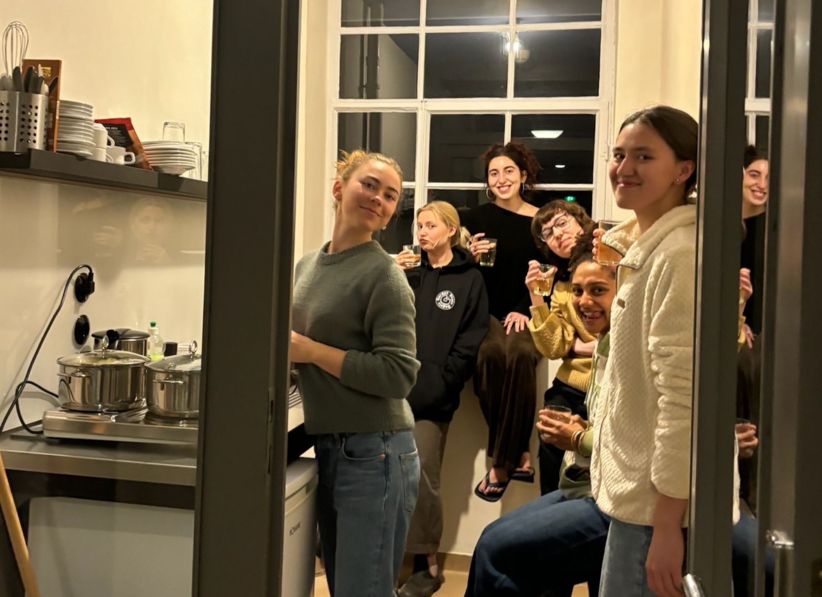 Student cluster in a small kitchen in Germany, cooking dinner