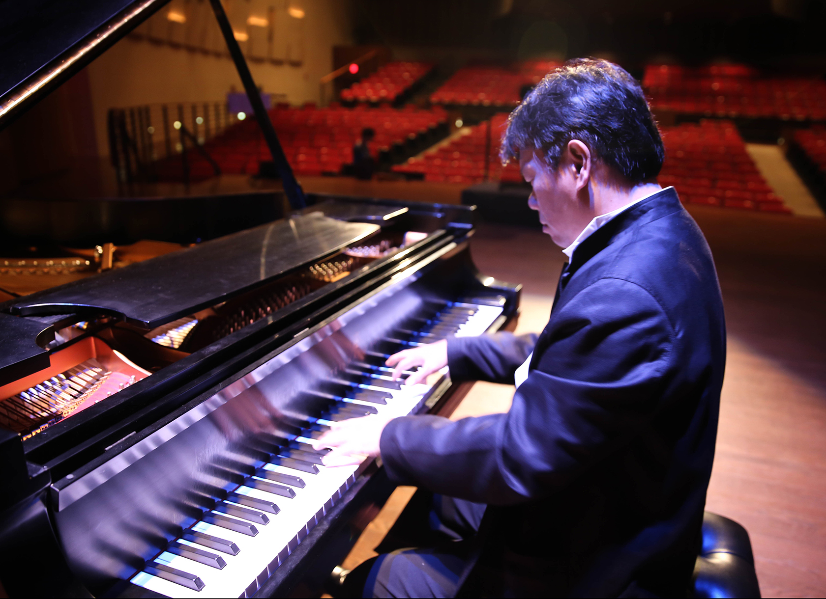 Professor Hao Huang playing the Piano