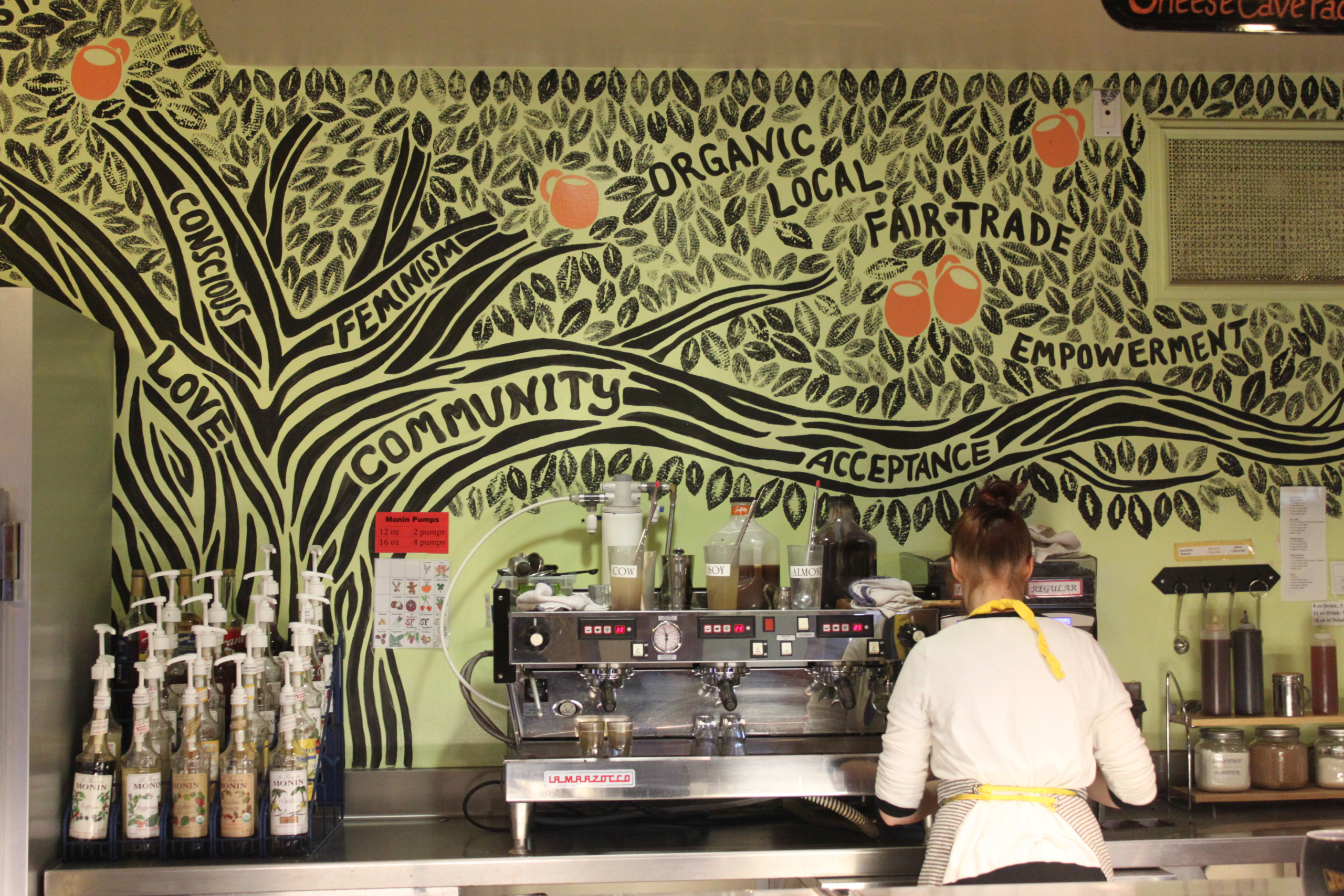 A barista brews a drink at Scripps College's Motley coffeehouse