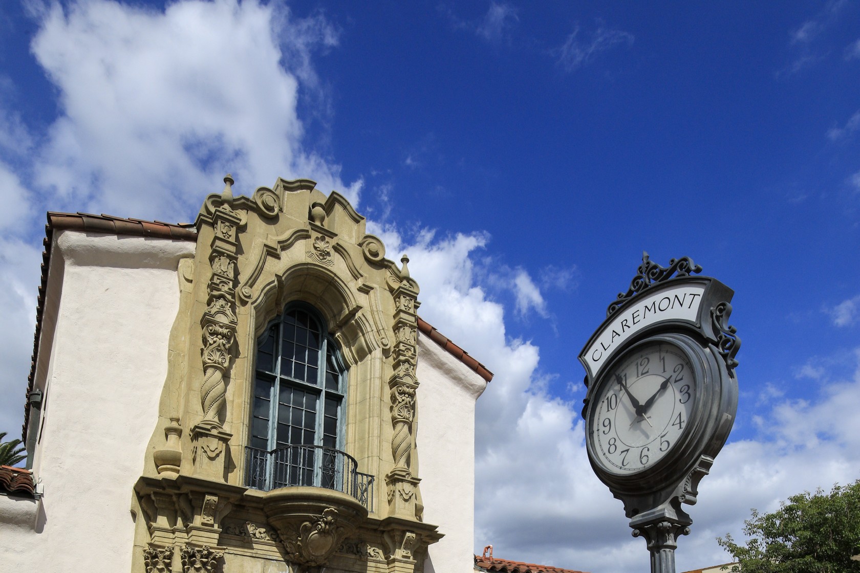 A clock outside a historic building in Claremont.
