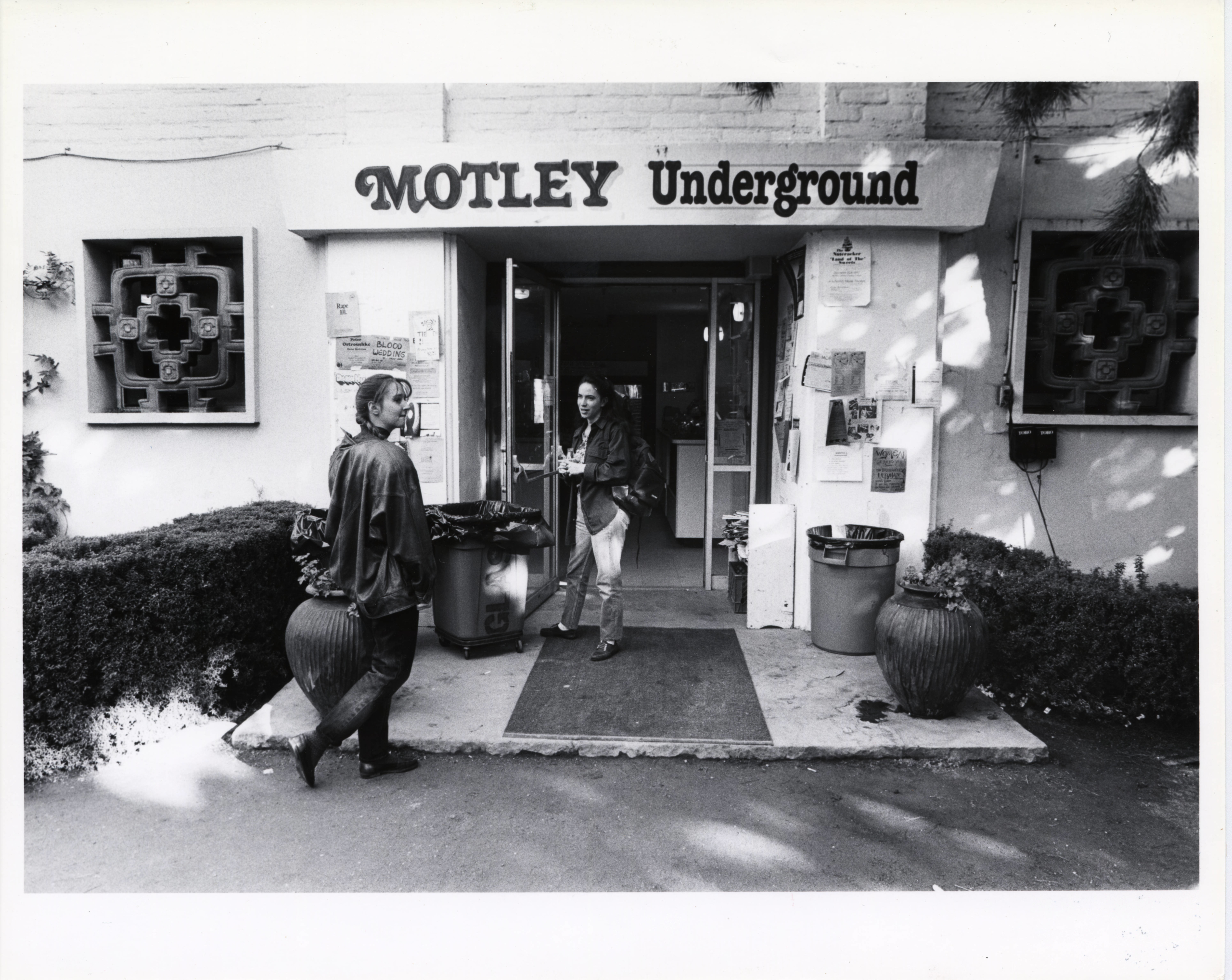 Black and white image of the Motley coffeehouse in one of its former locations at Scripps College