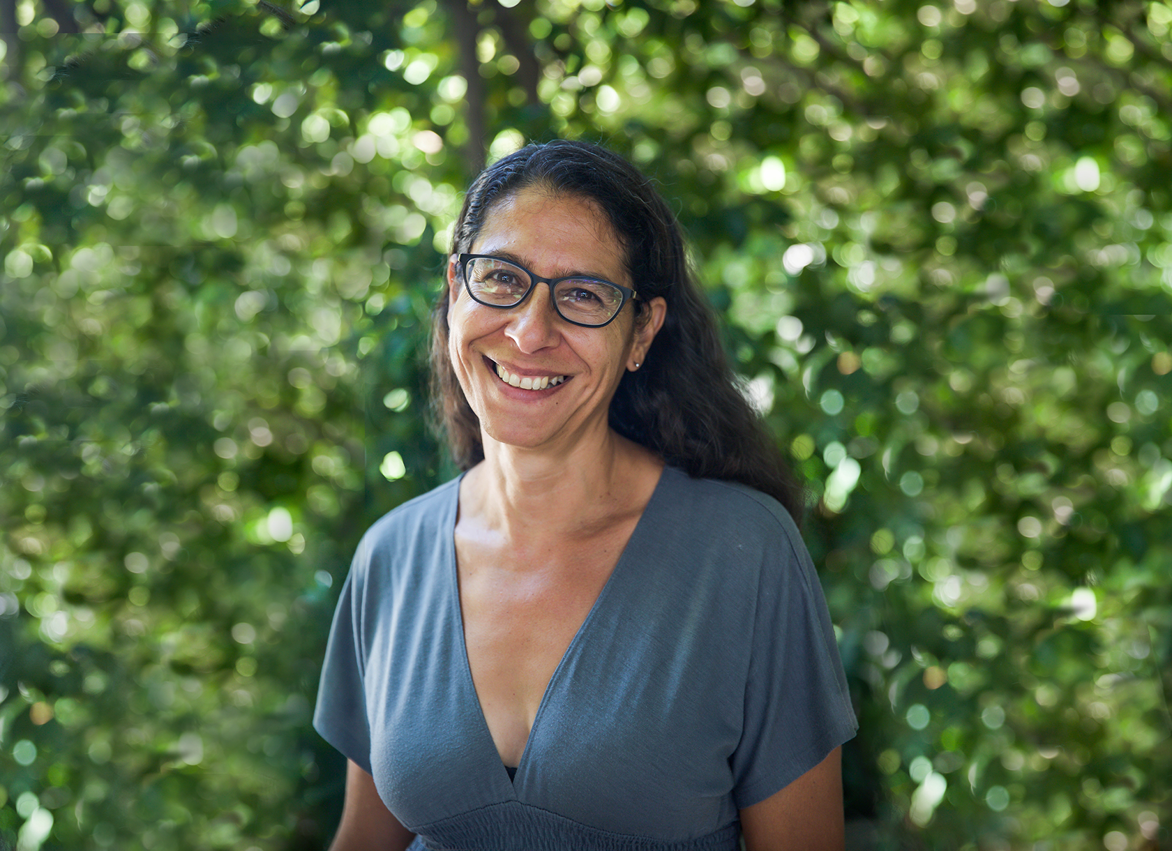 Close-up portrait of woman with long hair and glasses