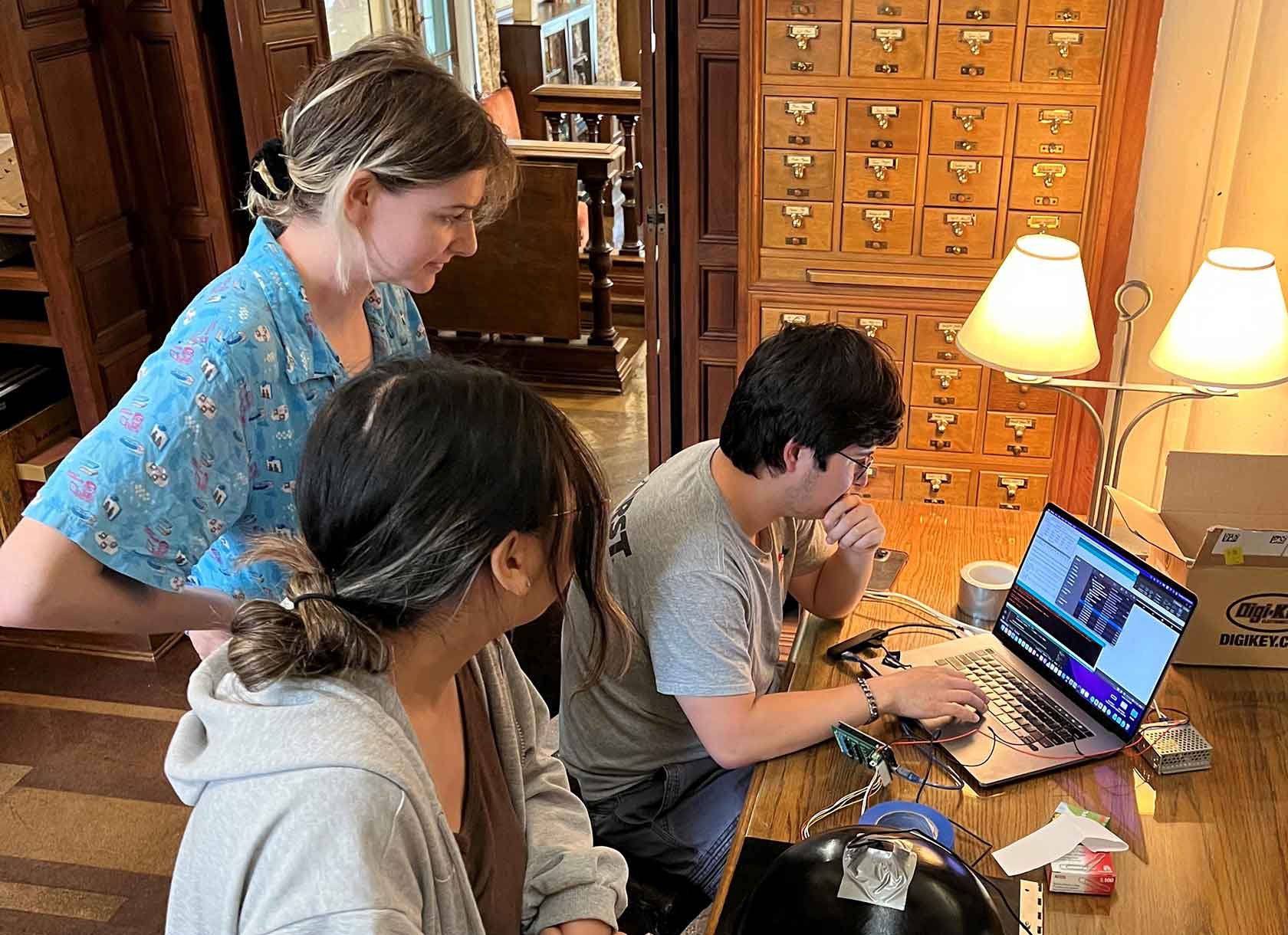 Students work on a digital art conservation project at Scripps College's Denison Library