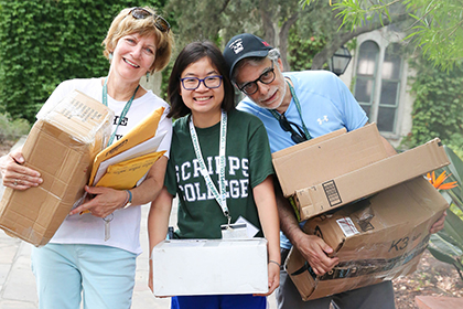 scripps student posing with parents