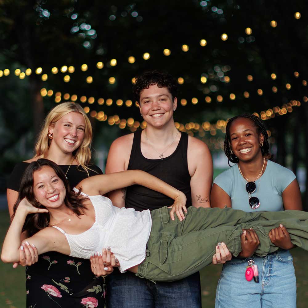 Students on Elm Tree Lawn at night