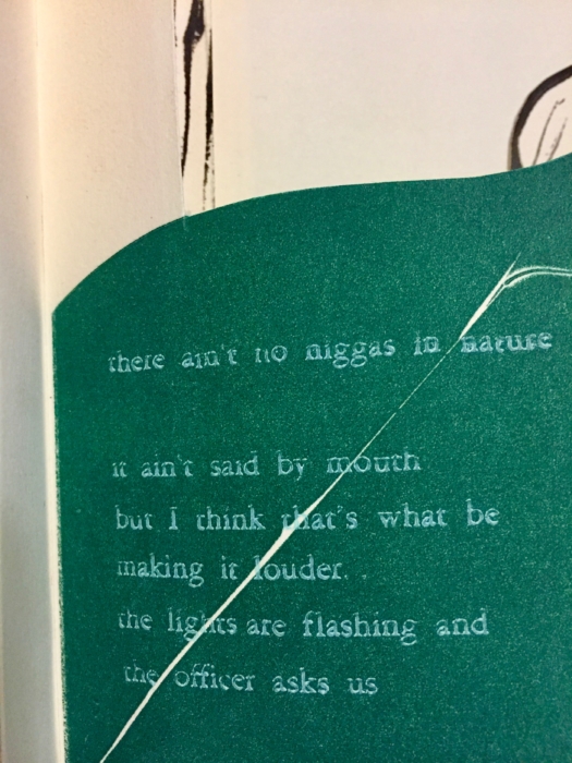 A close up of an open page in the same handmade book, where there is a block of words.