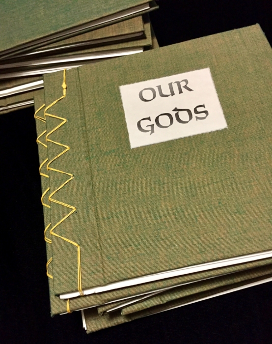 A green book with the title 'Our Gods'.