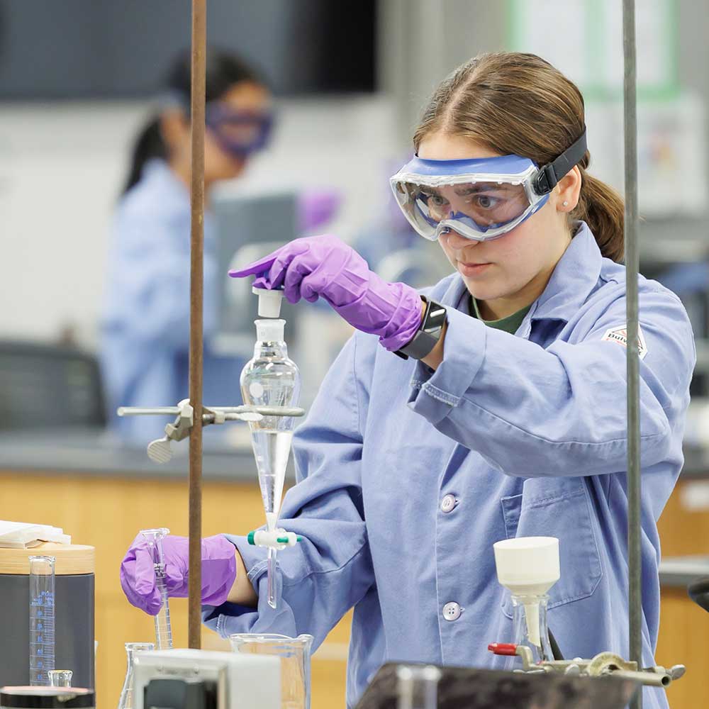 Student in the science lab working an an experiment