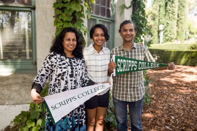 family holding up scripps pendants